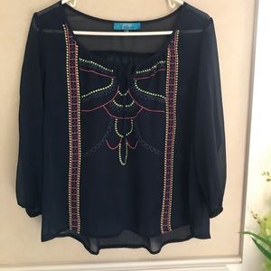 Buttons’ navy blue blouse